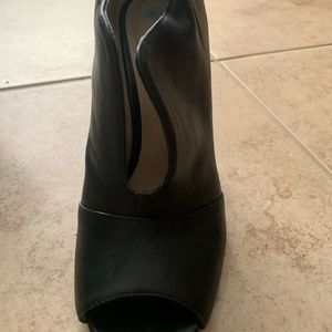 Size 6 open toe and top top black booties by Nine West.